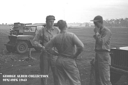Men by jeep near airstrip
